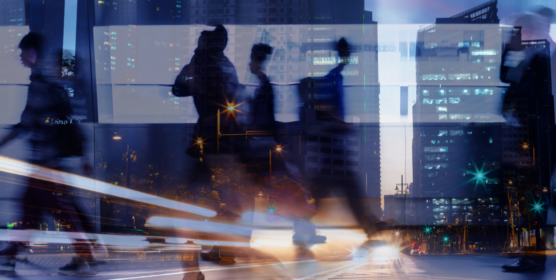 Dynamic urban street scene at night with motion-blurred pedestrians and illuminated skyscrapers, symbolizing fast-paced digital innovation and the evolving landscape of generative engine optimization.